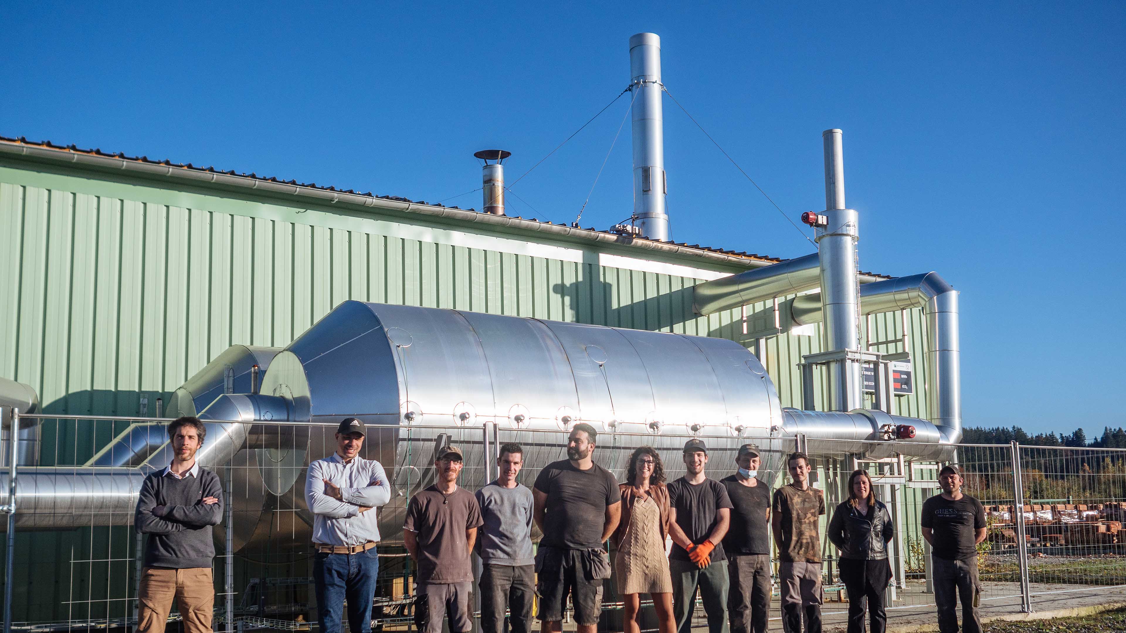 Equipe devant le procédé Eco Stock